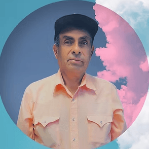 Juan, an older man in a cap and a peach-colored shirt, smiling